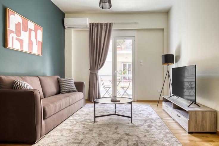 Elegantly designed living room with modern furnishings in an apartment at 2ef50789-f32a-4419-9758-7ab1444dc470 in Vasilissis Sofias Avenue, Athens