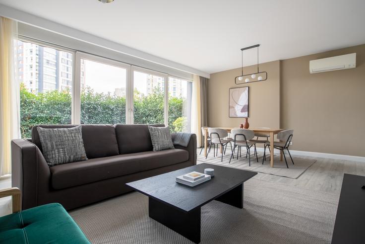 Elegantly designed living room with modern furnishings in an apartment at Inlife in Ataşehir, Istanbul