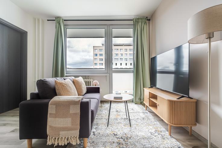 Elegante sala de estar con mobiliario moderno en un apartamento en Kotorská 1580/38, 140 00 Praha 4-Nusle en Prague 4, Prague Elegante sala de estar con mobiliario moderno en un apartamento en Kotorská 1580/38, 140 00 Praha 4-Nusle en Prague 4, Prague