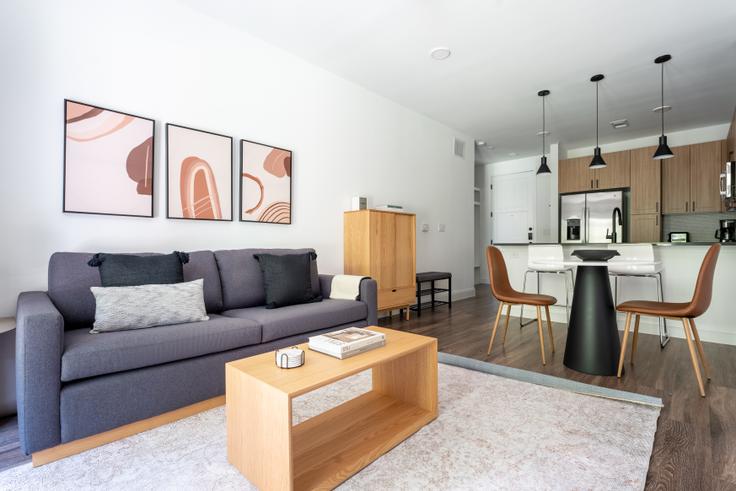 Elegantly designed living room with modern furnishings in an apartment at Troubadour in Central, Austin