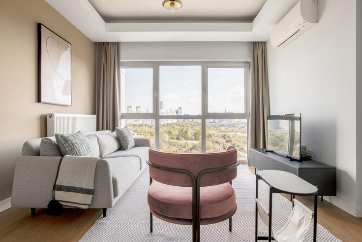 Elegantly designed living room with modern furnishings in an apartment at Agaoglu My Home in Maslak, Istanbul