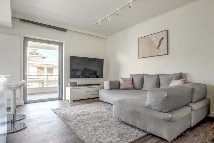 Chic living room with minimalist design from a furnished apartment in Glyfada, Athens