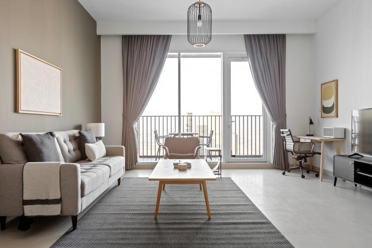 Elegantly designed living room with modern furnishings in an apartment at Creek Horizon Tower 1 in Dubai Creek Harbour, Dubai