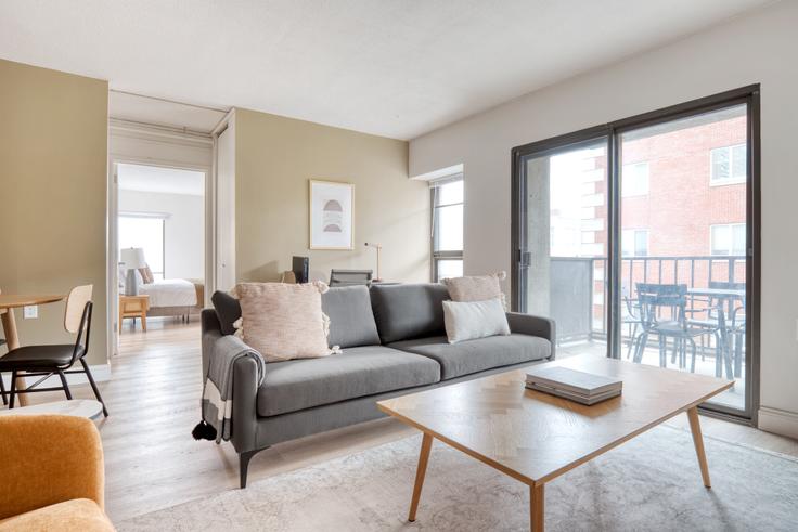 Elegantly designed living room with modern furnishings in an apartment at Babcock Tower in Allston, Boston