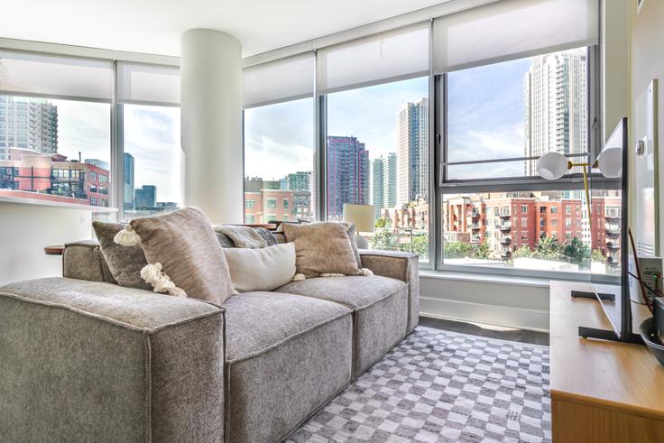 Elegantly designed living room with modern furnishings in an apartment at Left Bank in Chicago, Chicago Elegantly designed living room with modern furnishings in an apartment at Left Bank in Chicago, Chicago