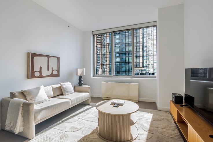 Elegantly designed living room with modern furnishings in an apartment at Hudson Landing in Manhattan, New York