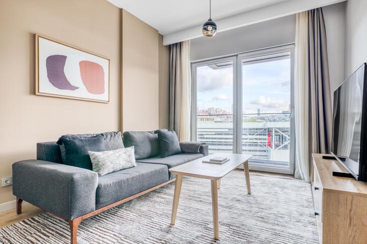 Elegantly designed living room with modern furnishings in an apartment at Nidapark Ayyıldız in Kağıthane, Istanbul