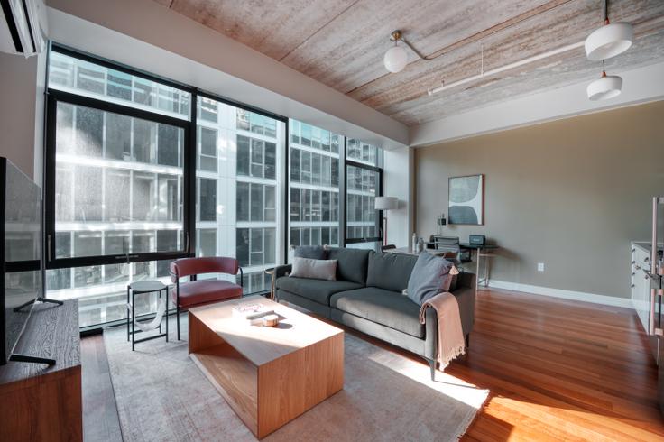 Elegantly designed living room with modern furnishings in an apartment at Ardus in River North, Chicago