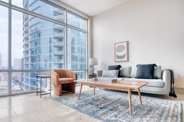 Elegantly designed living room with modern furnishings in an apartment at Ashton in Downtown, Austin