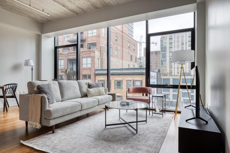 Elegantly designed living room with modern furnishings in an apartment at Ardus in River North, Chicago