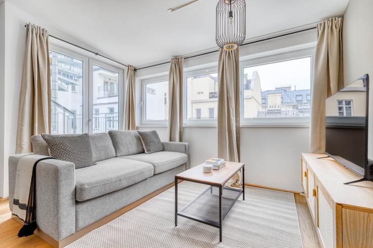 Elegantly designed living room with modern furnishings in an apartment at Schottenfeldgasse 35 / Stiege 1 in 7th District - Neubau, Vienna