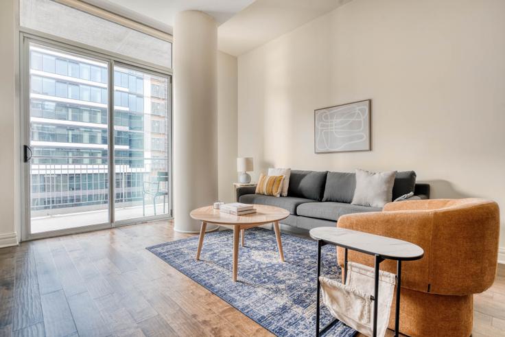 Elegantly designed living room with modern furnishings in an apartment at Whitley in Downtown, Austin