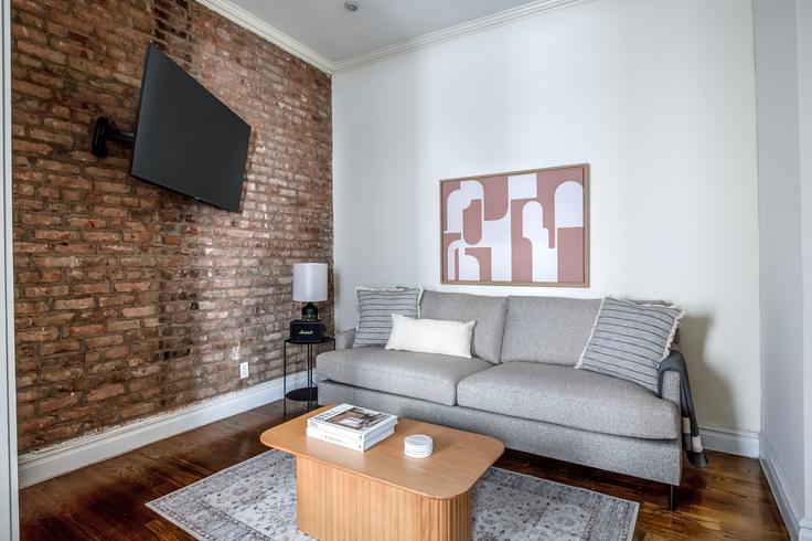 Elegantly designed living room with modern furnishings in an apartment at 535 Hudson Street in West Village, New York