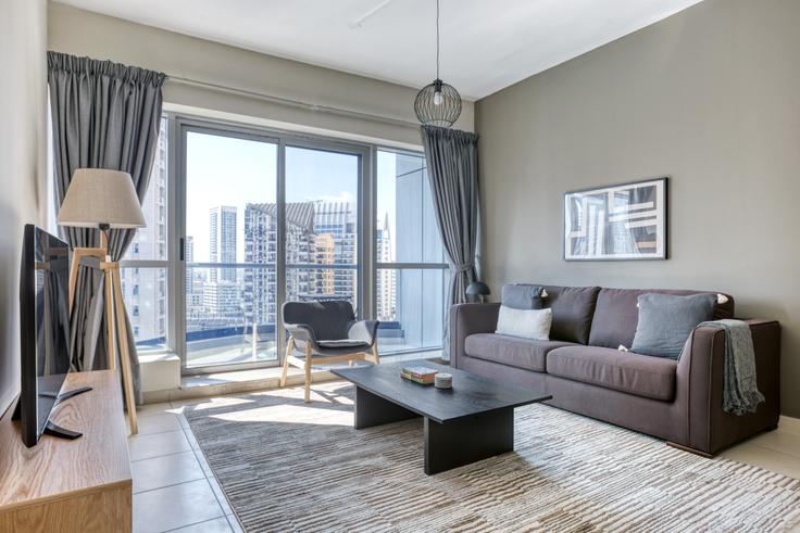 Salle de séjour élégante avec mobilier moderne dans un appartement à The Point à The Point Tower, Dubai