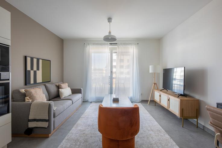 Elegantly designed living room with modern furnishings in an apartment at IM BRILL in Cessange, Luxembourg