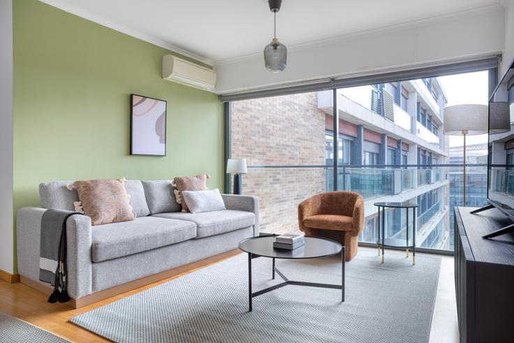 Elegantly designed living room with modern furnishings in an apartment at Alcântara-Rio III in Alcantara, Lisbon