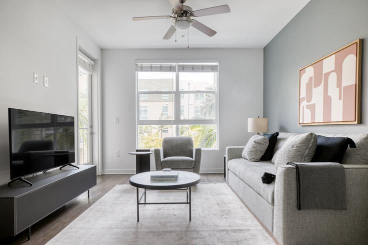 Elegantly designed living room with modern furnishings in an apartment at Metro Mission Valley in Mission Valley, San Diego