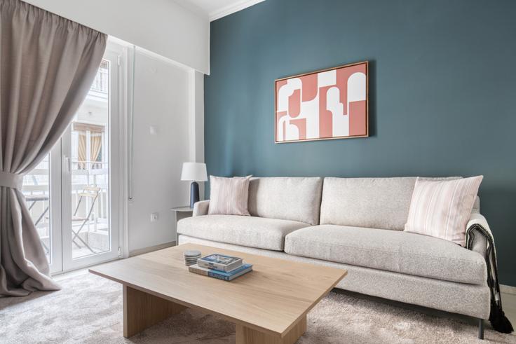 Elegantly designed living room with modern furnishings in an apartment at 1a798f86-e11e-49a9-99d9-c1d1cd21c4c2 in Ampelokipoi, Athens