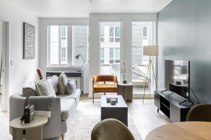 Elegantly designed living room with modern furnishings in an apartment at Jackson in Central District, Seattle