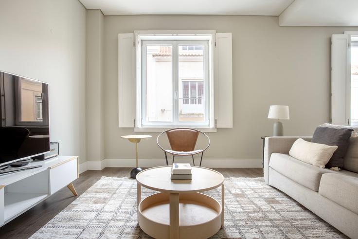 Elegantly designed living room with modern furnishings in an apartment at Misericórdia 116 in Chiado, Lisbon