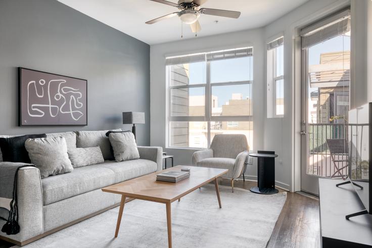 Elegantly designed living room with modern furnishings in an apartment at Metro Mission Valley in Mission Valley, San Diego