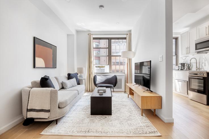 Elegantly designed living room with modern furnishings in an apartment at The Buchanan in Midtown, New York