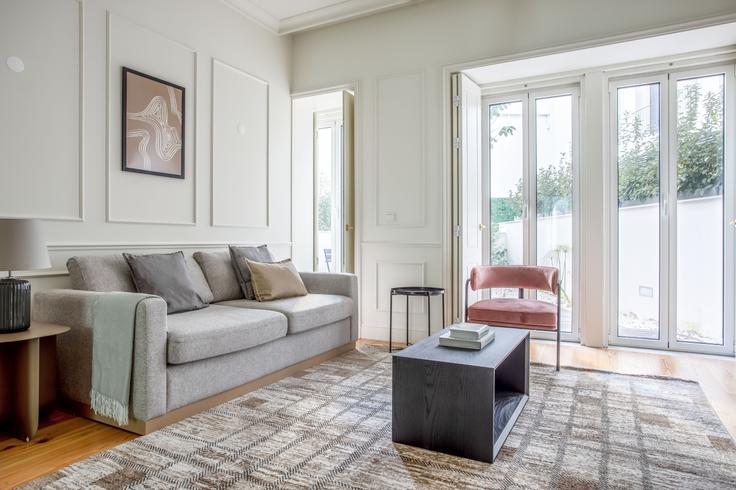 Elegantly designed living room with modern furnishings in an apartment at Casal Ribeiro 53 II in Saldanha, Lisbon