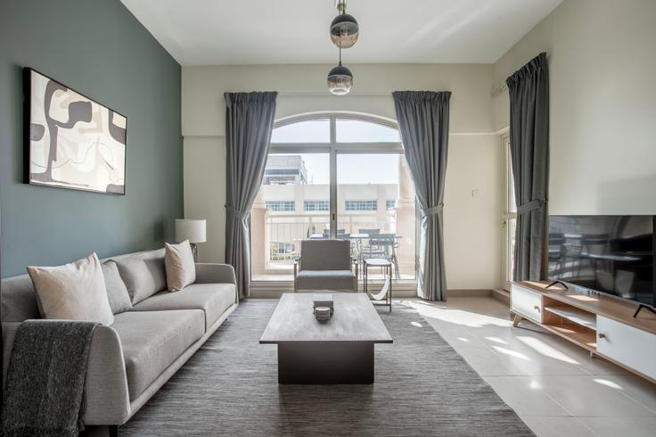 Elegantly designed living room with modern furnishings in an apartment at Mosela Waterside Residences in Mosela Tower, Dubai