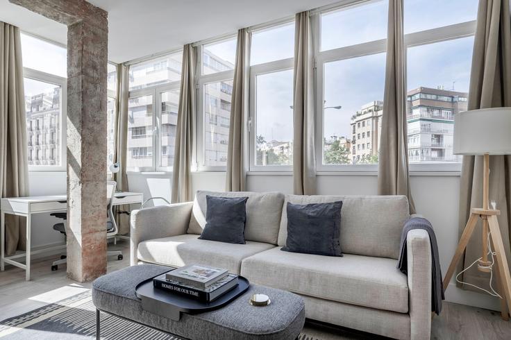 Elegantly designed living room with modern furnishings in an apartment at Conde de Peñalver 96 in Lista, Madrid