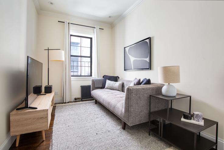 Elegantly designed living room with modern furnishings in an apartment at 535 Hudson Street in West Village, New York