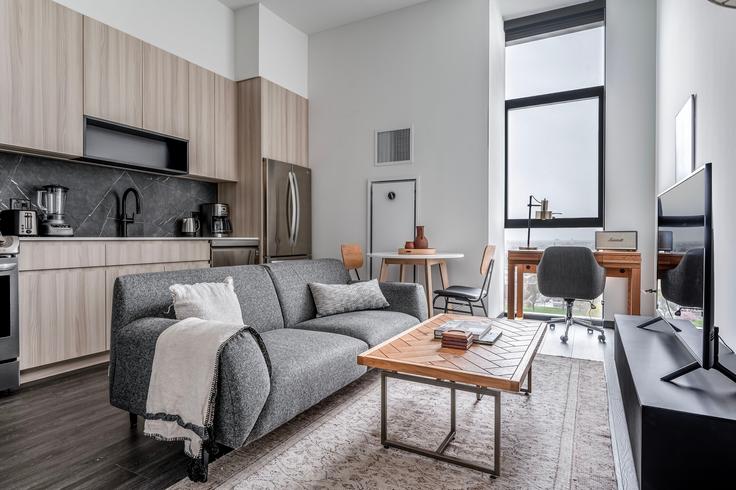 Elegantly designed living room with modern furnishings in an apartment at Parq Fulton in Chicago, Chicago