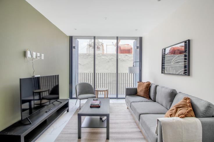 Elegantly designed living room with modern furnishings in an apartment at Ava Rio Rhin 9 in Cuauhtémoc, Mexico City