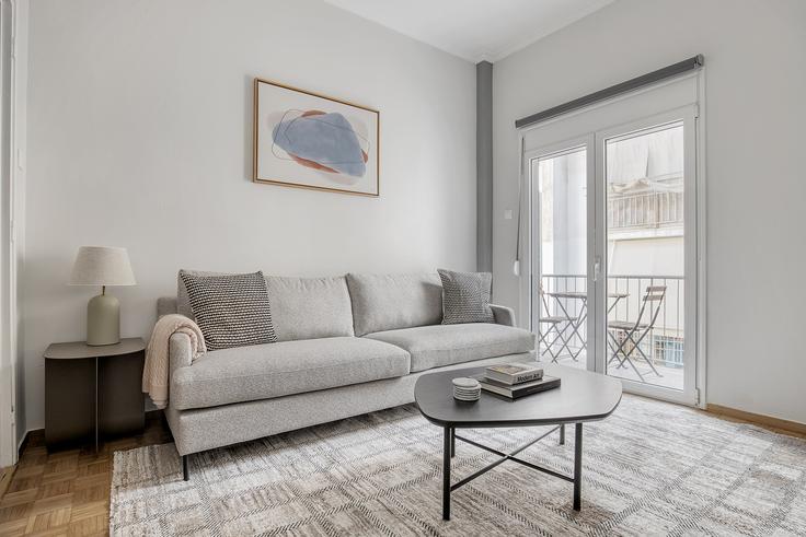 Chic living room with minimalist design from a furnished apartment in Koukaki, Athens