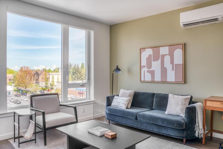 Elegantly designed living room with modern furnishings in an apartment at Jackson in Central District, Seattle