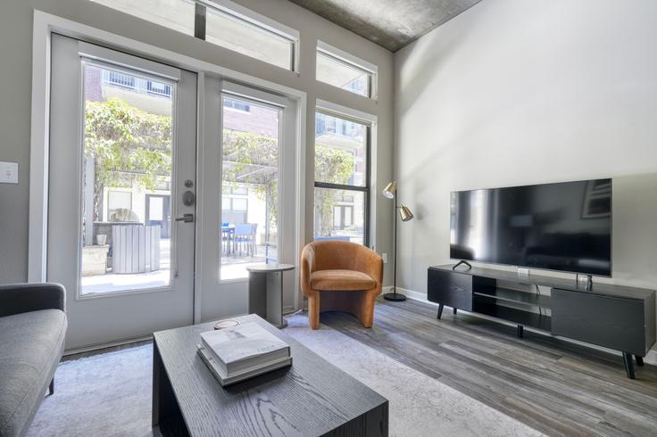 Elegantly designed living room with modern furnishings in an apartment at Coldwater in Zilker, Austin