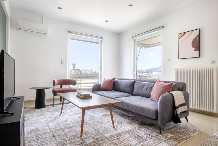 Chic living room with minimalist design from a furnished apartment in Marousi, Athens