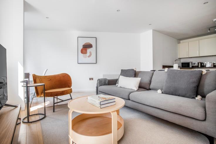 Elegantly designed living room with modern furnishings in an apartment at Shoreditch Heights in Old Street, London