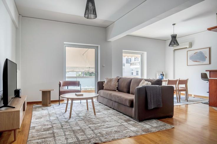 Chic living room with minimalist design from a furnished apartment in Agia Paraskevi, Athens