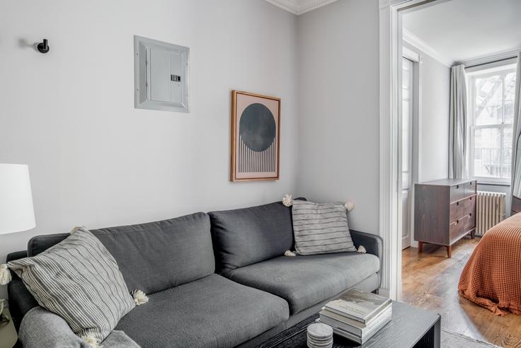 Elegantly designed living room with modern furnishings in an apartment at 118 Christopher Street in West Village, New York