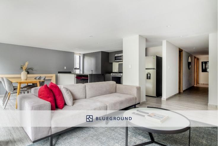 Sala de estar elegantemente projetada com móveis modernos em um apartamento no JVM 421 em Mexico City, Mexico City Sala de estar elegantemente projetada com móveis modernos em um apartamento no JVM 421 em Mexico City, Mexico City