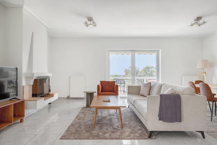 Chic living room with minimalist design from a furnished apartment in Glyfada, Athens