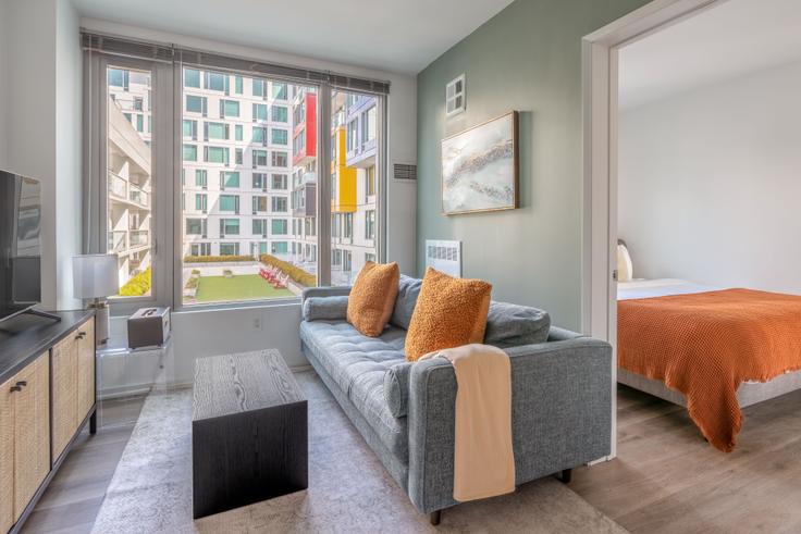 Elegantly designed living room with modern furnishings in an apartment at Mosso 900 in SoMa, San Francisco Bay Area