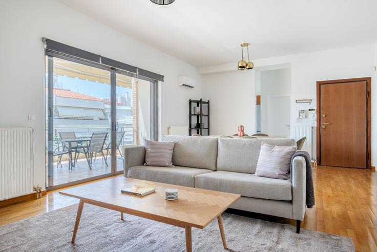 Elegantly designed living room with modern furnishings in an apartment at 353407a5-b9a9-490e-aed4-d7b7ed0b30da in Glyfada, Athens