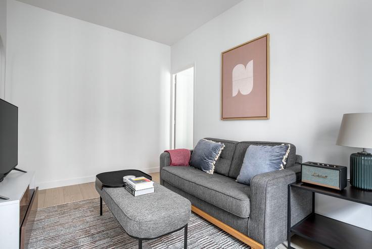 Elegantly designed living room with modern furnishings in an apartment at Delta 12 in 9th arrondissement, Paris