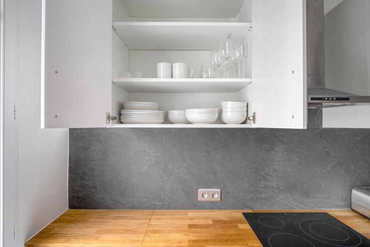 Functional and stylish kitchen with top-of-the-line equipment in an upscale apartment at Delta 12 in 9th arrondissement, Paris