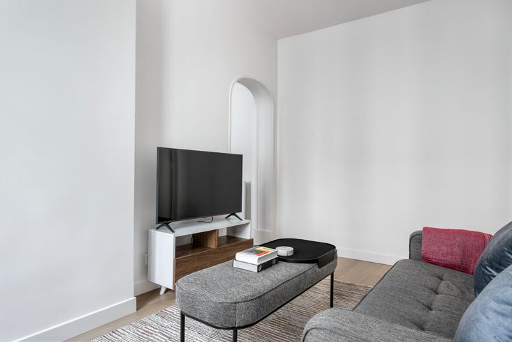 Elegantly designed living room with modern furnishings in an apartment at Delta 12 in 9th arrondissement, Paris