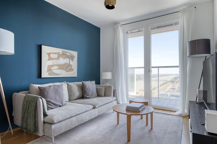 Elegantly designed living room with modern furnishings in an apartment at Marinatower Stiege 2 / High Rise in 2nd district - Leopoldstadt, Vienna