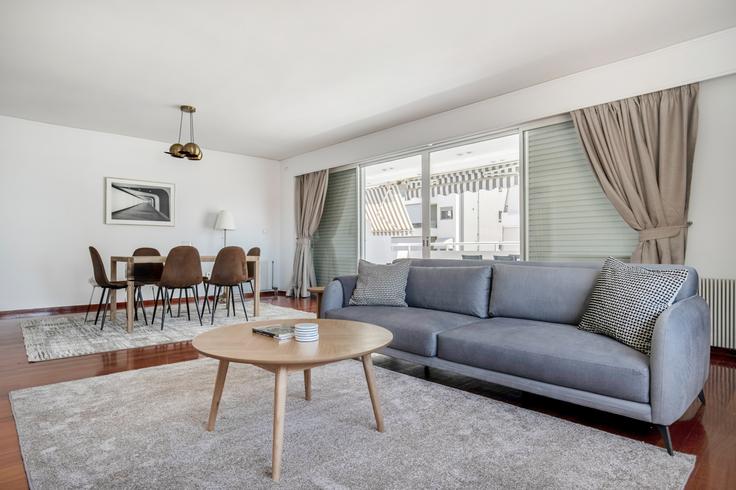 Chic living room with minimalist design from a furnished apartment in Palaio Faliro, Athens