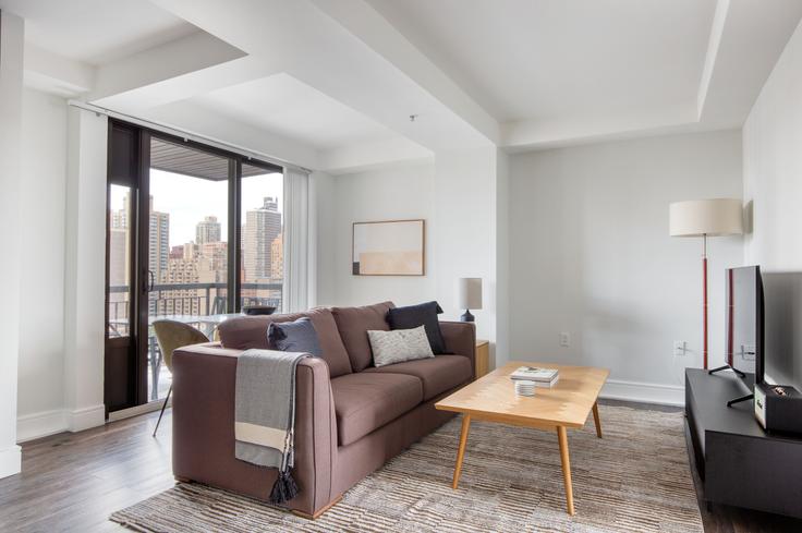 Elegantly designed living room with modern furnishings in an apartment at The Cole in Upper East Side, New York