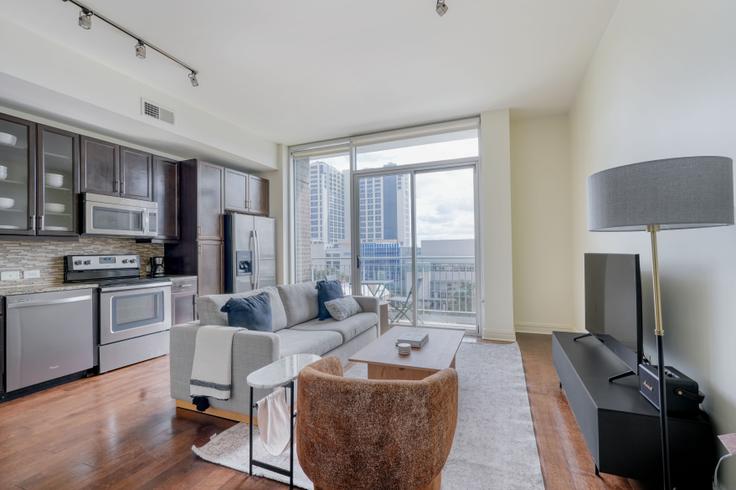 Elegantly designed living room with modern furnishings in an apartment at Whitley in Downtown, Austin